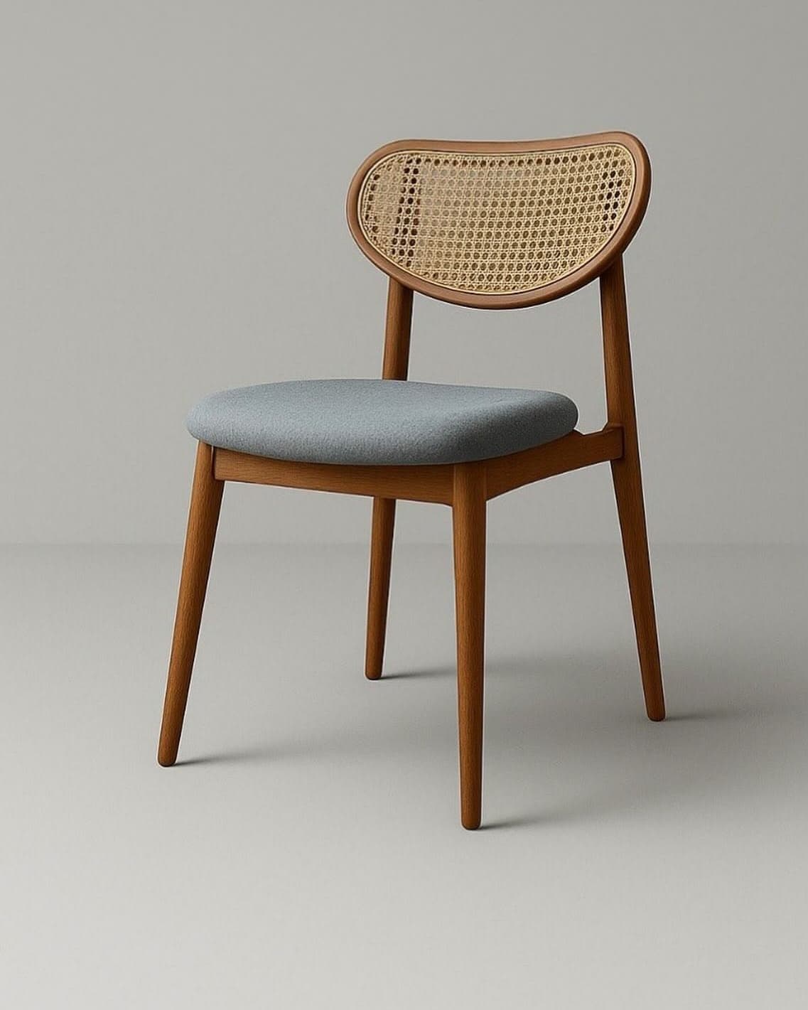 CANEVA premium dining chair with natural cane backrest, grey upholstered seat and warm walnut wooden frame.
