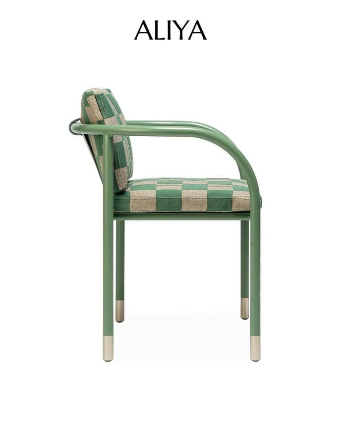 ALIYA dining armchair with a sage-green curved metal frame and green-and-beige patterned upholstery, shown in side profile.