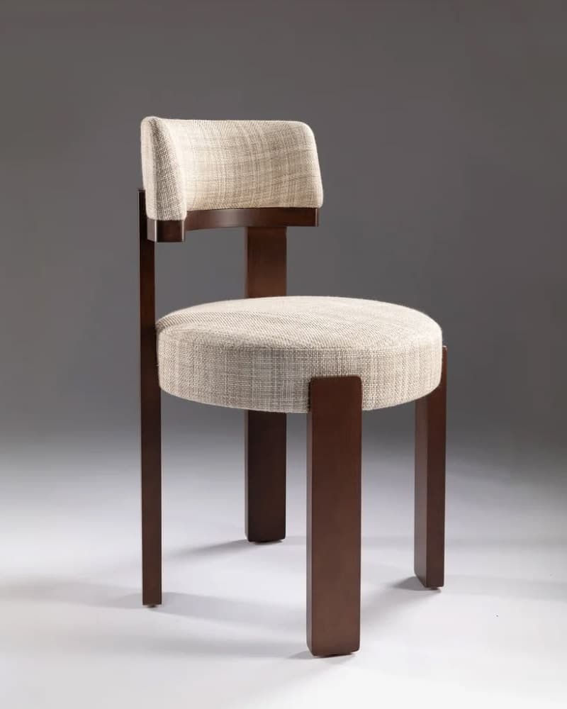 MIRAÉ premium dining chair with a dark walnut wooden frame, cream upholstered seat and floating backrest in a contemporary studio setting.