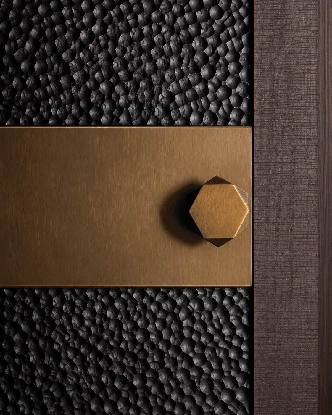 Black Hammered Accent Main Door installed in a contemporary interior, featuring dark textured panels, a smooth bronze-toned central band and a geometric metallic knob.